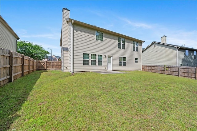 152 Maxton Ave, Dallas, GA 30132 - back of property with a chimney and a patio
