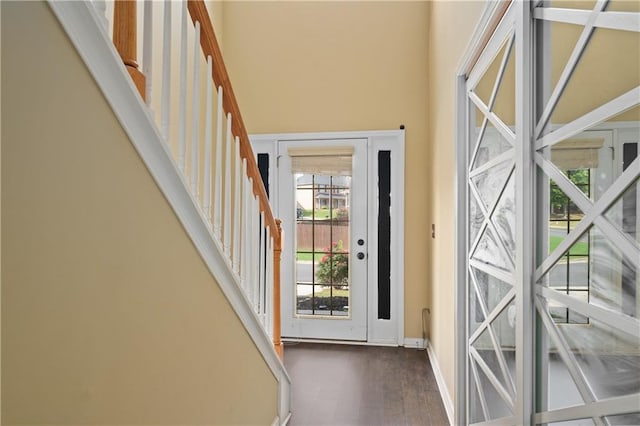 152 Maxton Ave, Dallas, GA 30132 - doorway featuring stairs, wood finished floors, baseboards, and a high ceiling