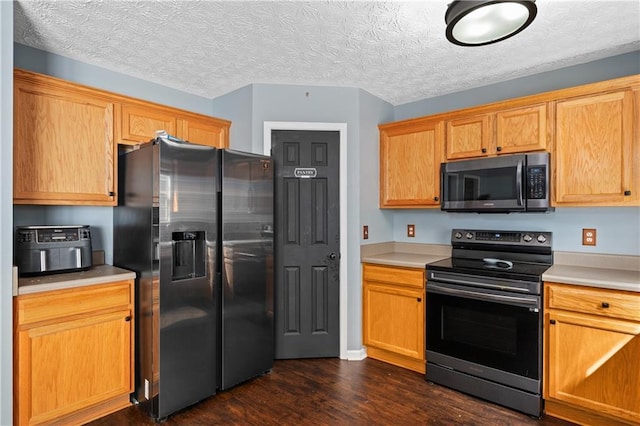 152 Maxton Ave, Dallas, GA 30132 - kitchen with appliances with stainless steel finishes, dark wood-style flooring, light countertops, and a textured ceiling