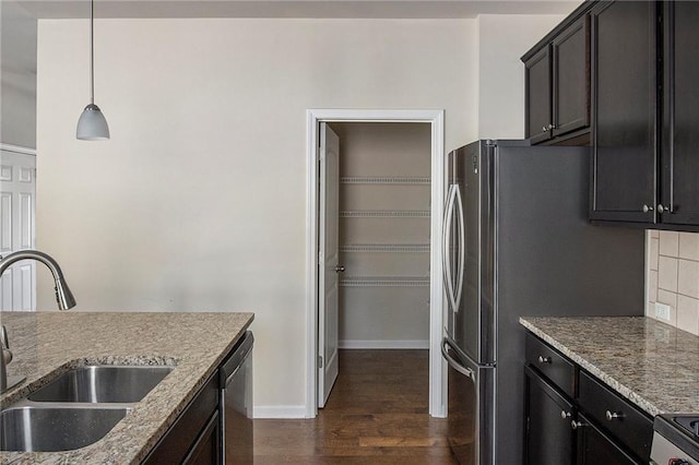 3013 Nicholas Dr, Villa Rica, GA 30180 - kitchen with a sink, dark wood-style floors, baseboards, appliances with stainless steel finishes, and light stone countertops