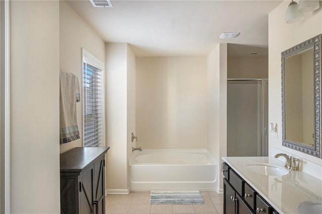 3013 Nicholas Dr, Villa Rica, GA 30180 - bathroom with tile patterned floors, baseboards, a bath, double vanity, and a shower