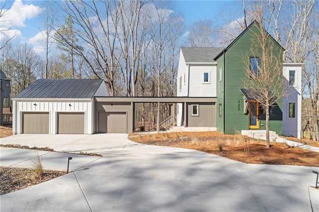 view of front of house featuring a garage, driveway, and board and batten siding