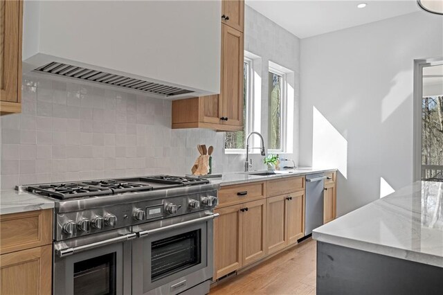 kitchen featuring a kitchen island, dark hardwood / wood-style flooring, hanging light fixtures, and stainless steel stove