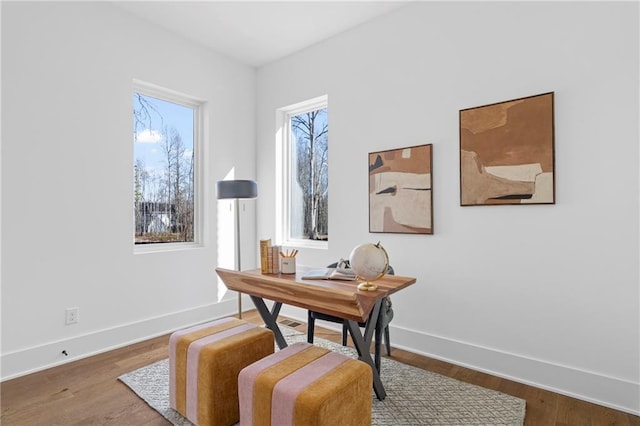office area featuring baseboards and wood finished floors