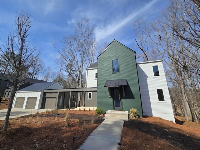 view of front of property with driveway and an attached garage