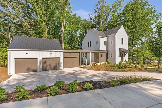 135 Cedarwood Ln, Roswell, GA 30075 - view of front of property with concrete driveway and an attached garage