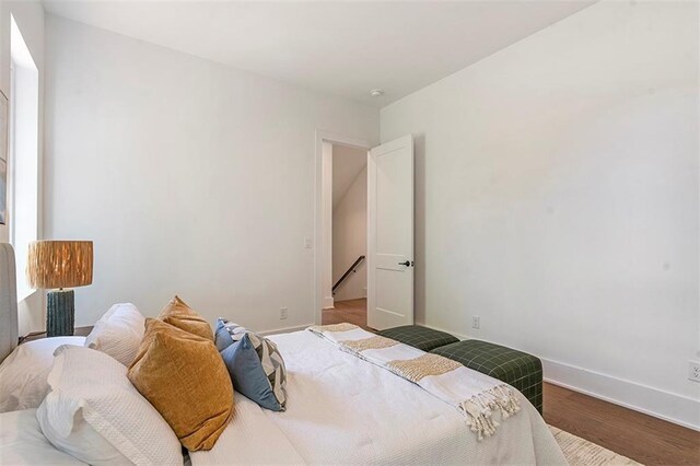 135 Cedarwood Ln, Roswell, GA 30075 - bedroom featuring baseboards and wood finished floors