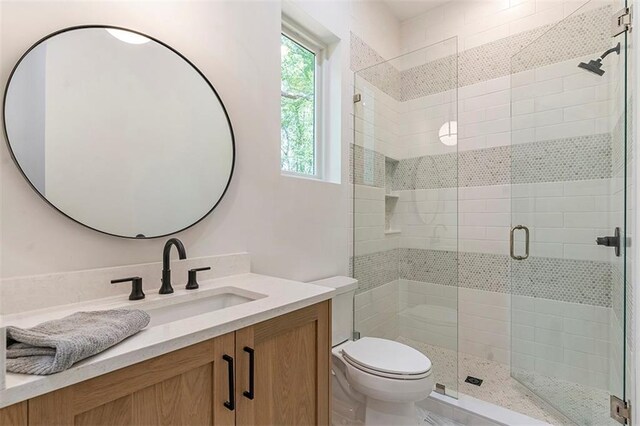 135 Cedarwood Ln, Roswell, GA 30075 - full bathroom with marble finish floors, vanity, a tile shower, and toilet
