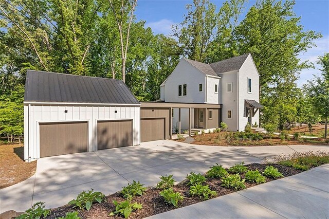 135 Cedarwood Ln, Roswell, GA 30075 - view of side of home featuring driveway and an attached garage