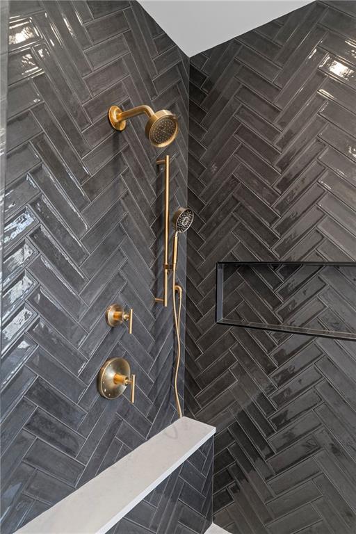 full bath featuring a tile shower
