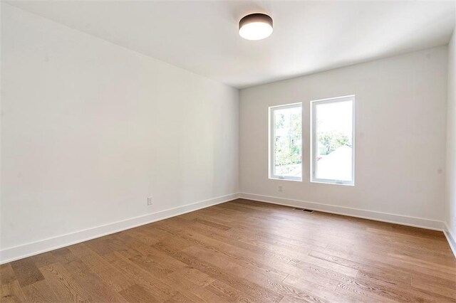 135 Cedarwood Ln, Roswell, GA 30075 - bedroom featuring a chandelier, high vaulted ceiling, multiple windows, wood finished floors, and baseboards