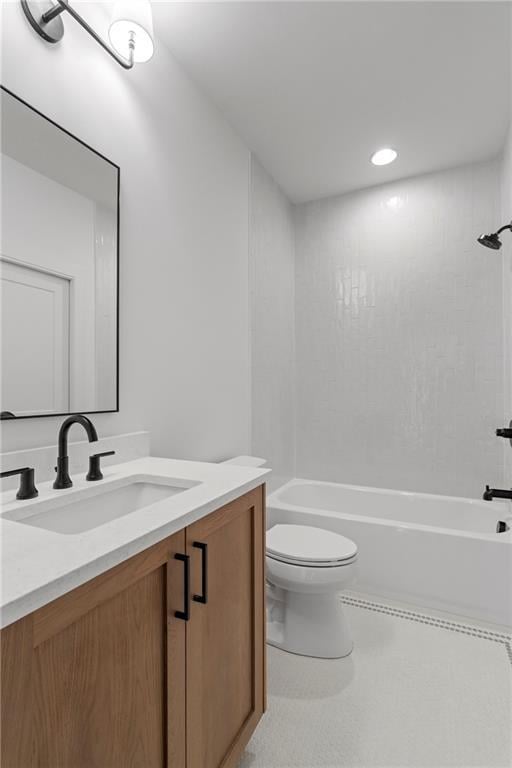 full bath featuring toilet, vanity, and shower / washtub combination