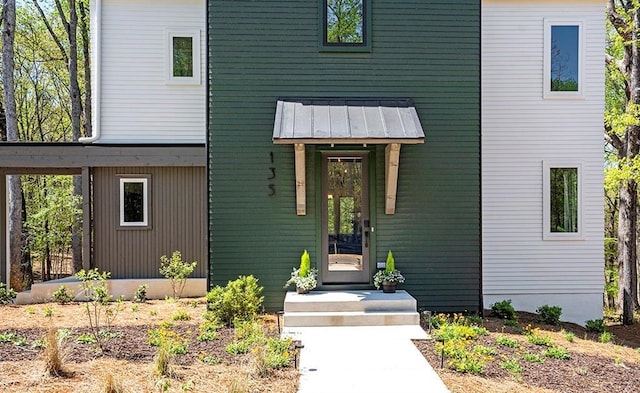 contemporary house with a standing seam roof and metal roof