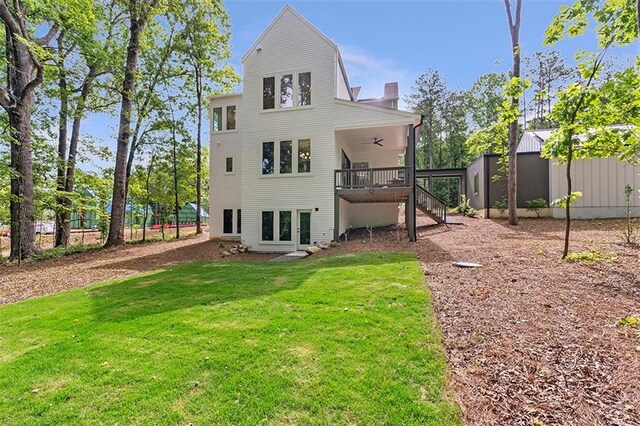 135 Cedarwood Ln, Roswell, GA 30075 - back of house with ceiling fan and stairs