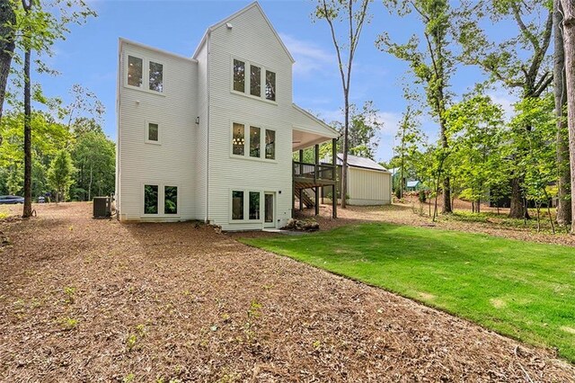 135 Cedarwood Ln, Roswell, GA 30075 - rear view of house with ceiling fan and stairway