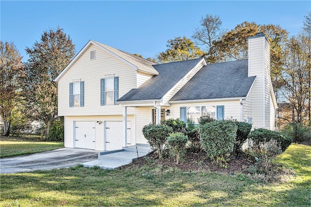 view of front of house with a front lawn and a garage