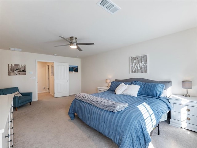 bedroom with ceiling fan and light colored carpet