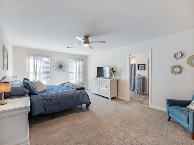 bedroom featuring ceiling fan and light carpet