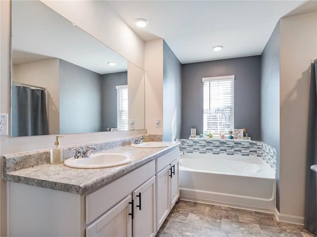 bathroom featuring vanity and a bathtub