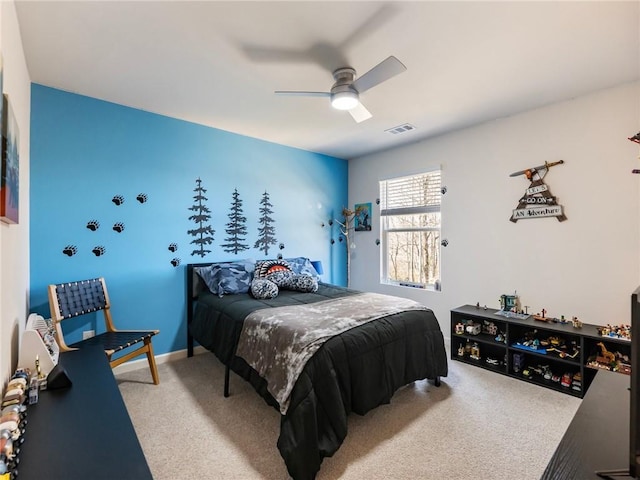 bedroom featuring ceiling fan and carpet