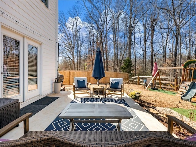 view of patio / terrace featuring a playground and an outdoor hangout area