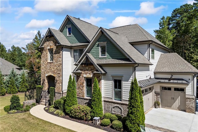 3111 Old Thompson Mill Rd, Buford, GA 30519 - craftsman-style house featuring stone siding, an attached garage, a shingled roof, driveway, and a front lawn