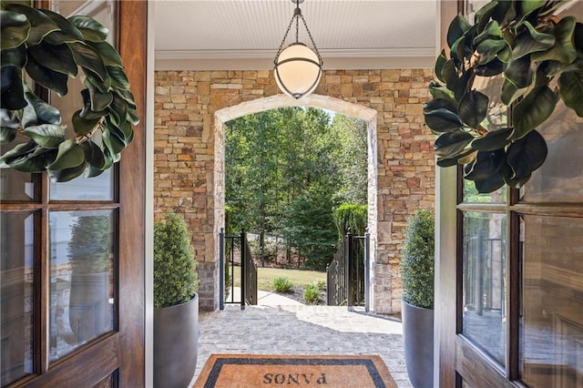 3111 Old Thompson Mill Rd, Buford, GA 30519 - doorway to outside featuring crown molding