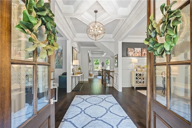 3111 Old Thompson Mill Rd, Buford, GA 30519 - foyer with a chandelier, dark wood-type flooring, coffered ceiling, baseboards, and crown molding