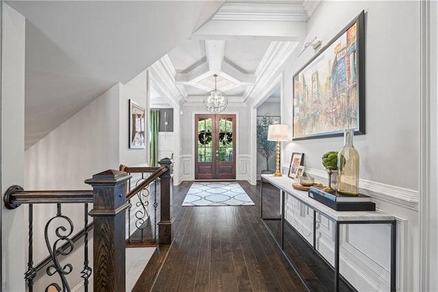 3111 Old Thompson Mill Rd, Buford, GA 30519 - foyer entrance featuring a chandelier, dark wood-type flooring, ornamental molding, coffered ceiling, and a decorative wall