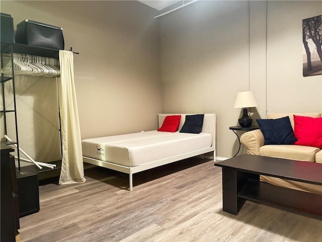 bedroom featuring wood finished floors