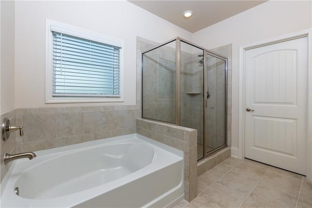 bathroom with tile patterned flooring and plus walk in shower