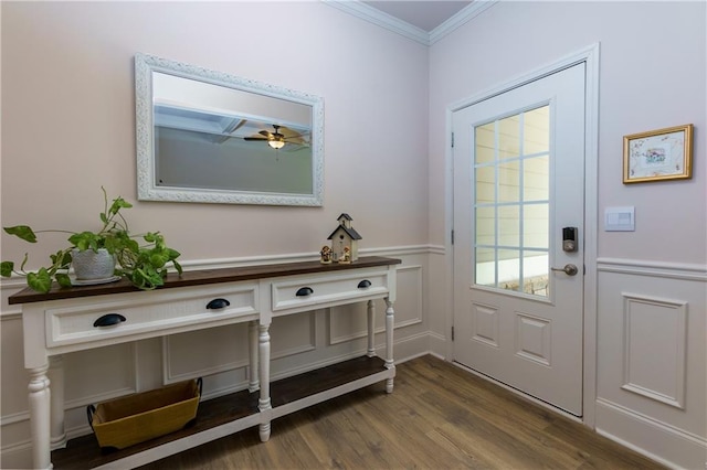 doorway to outside with wood-type flooring, ceiling fan, and crown molding