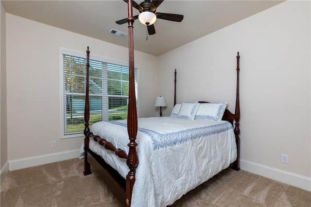 bedroom featuring light colored carpet and ceiling fan