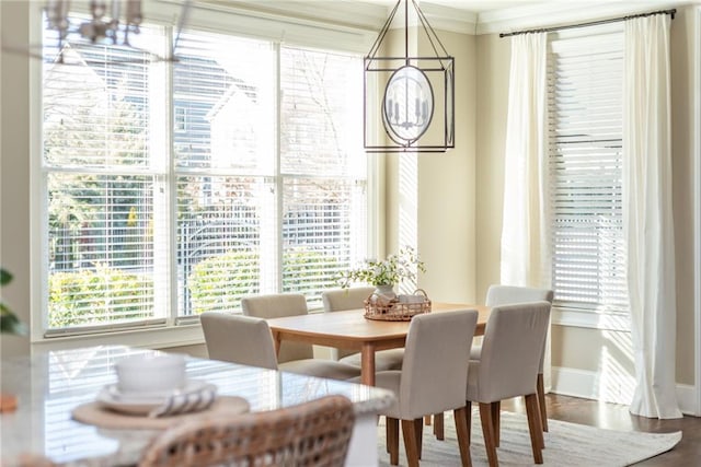 dining room featuring crown molding and wood-type flooring