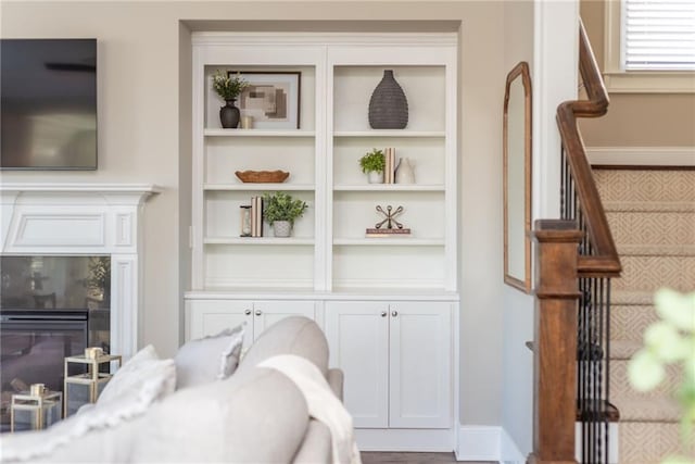 interior space with a premium fireplace and hardwood / wood-style flooring