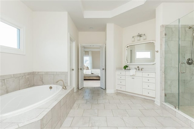 bathroom featuring plenty of natural light, vanity, tile patterned floors, and independent shower and bath