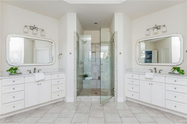 bathroom with a shower with door and vanity