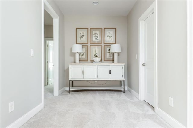 corridor with light colored carpet