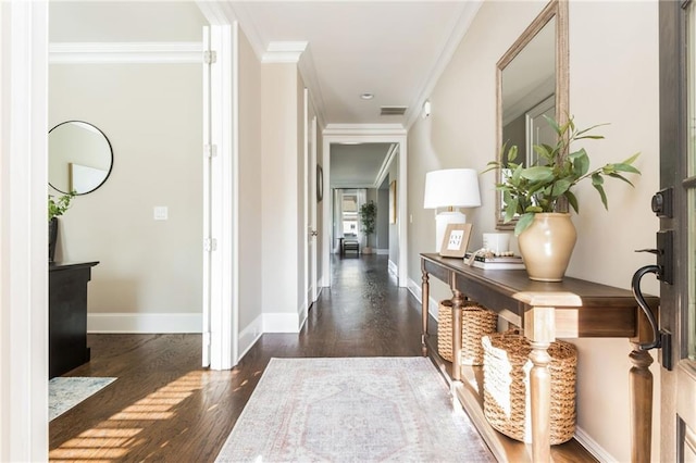 corridor featuring ornamental molding and dark wood-type flooring