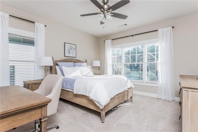 carpeted bedroom with ceiling fan