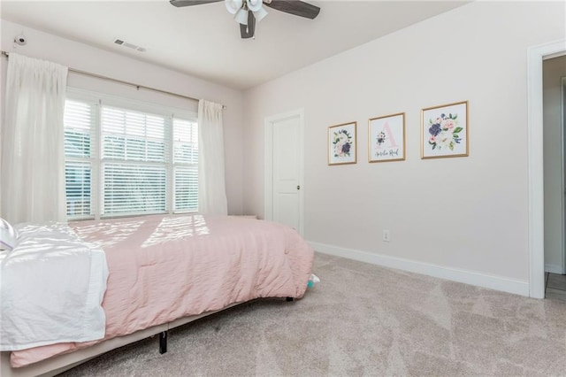 carpeted bedroom featuring ceiling fan