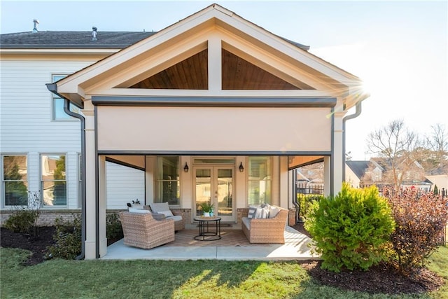 back of house with a patio, outdoor lounge area, and a yard