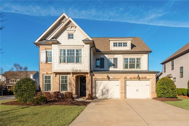 view of front of house with a garage and a front lawn