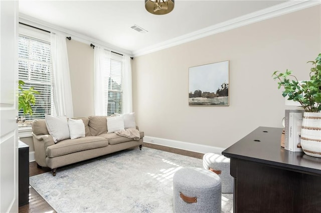 living room featuring hardwood / wood-style flooring and ornamental molding