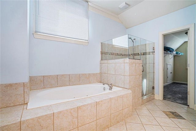 3641 Mountain Cove Rd, Snellville, GA 30039 - bathroom with a stall shower, tile patterned floors, a spacious closet, and a garden tub
