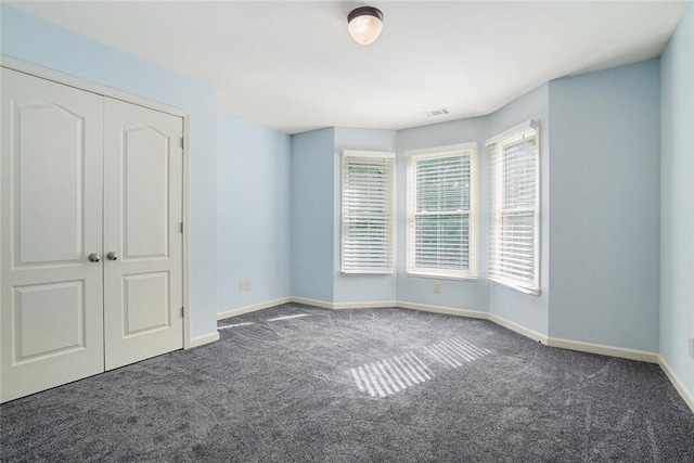 3641 Mountain Cove Rd, Snellville, GA 30039 - unfurnished bedroom featuring carpet, baseboards, and a closet