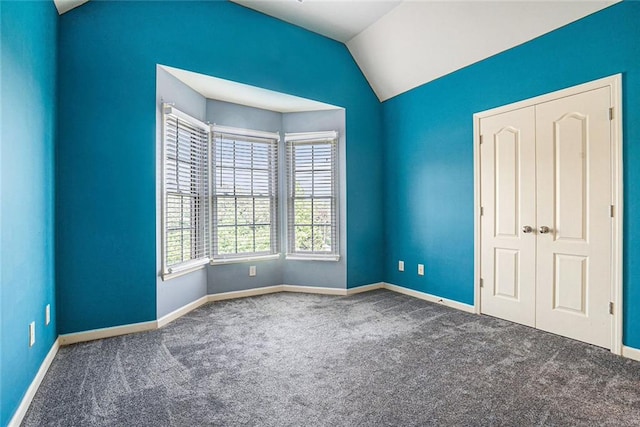 3641 Mountain Cove Rd, Snellville, GA 30039 - unfurnished bedroom with carpet floors, baseboards, and lofted ceiling
