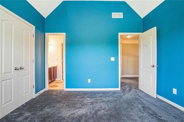 3641 Mountain Cove Rd, Snellville, GA 30039 - unfurnished bedroom with lofted ceiling, carpet floors, and baseboards
