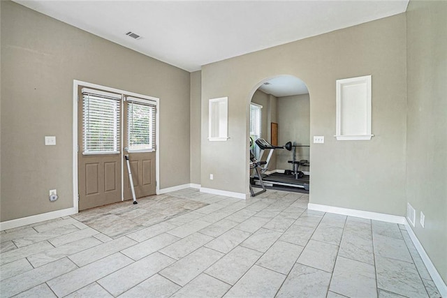 3641 Mountain Cove Rd, Snellville, GA 30039 - entrance foyer featuring arched walkways and baseboards