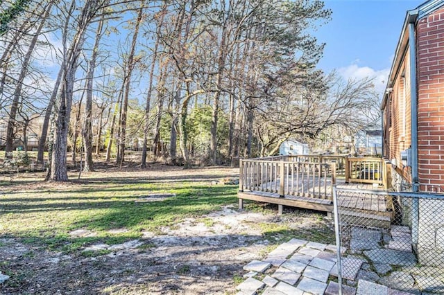 view of yard featuring a wooden deck